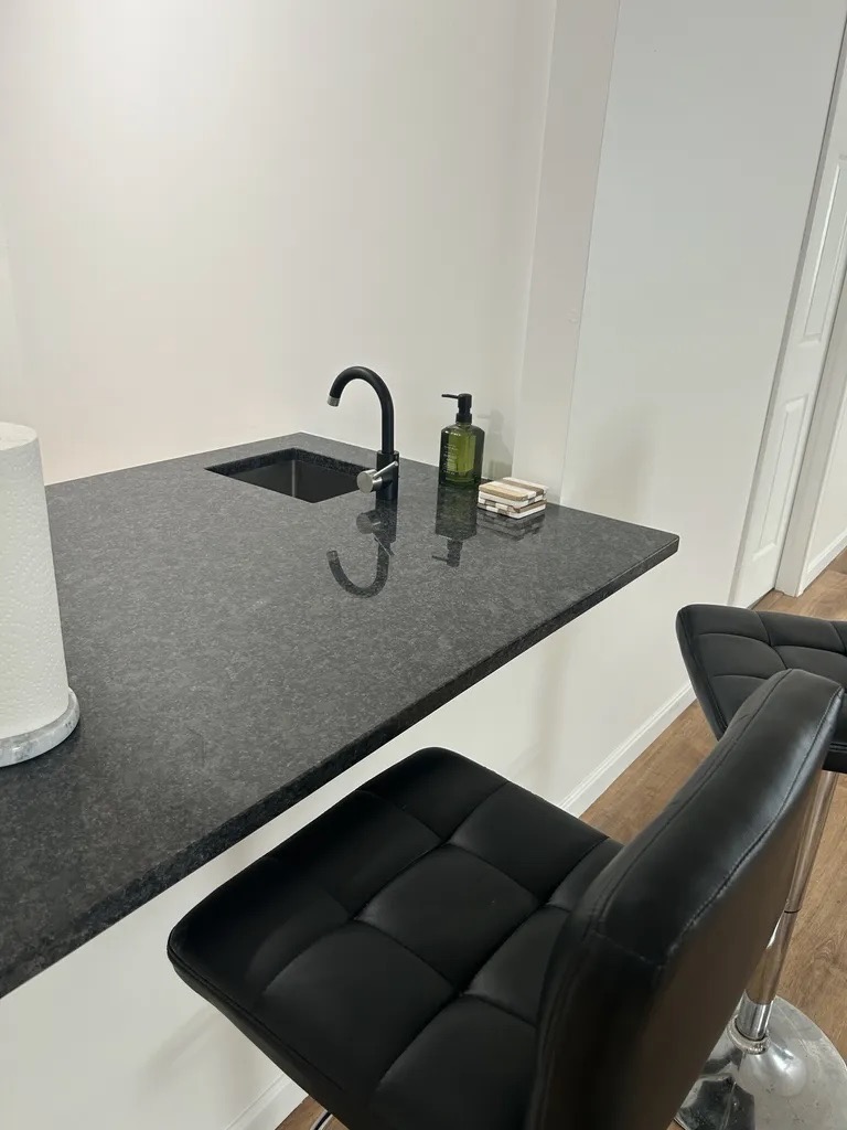 Basement bar — granite countertop with undermount sink