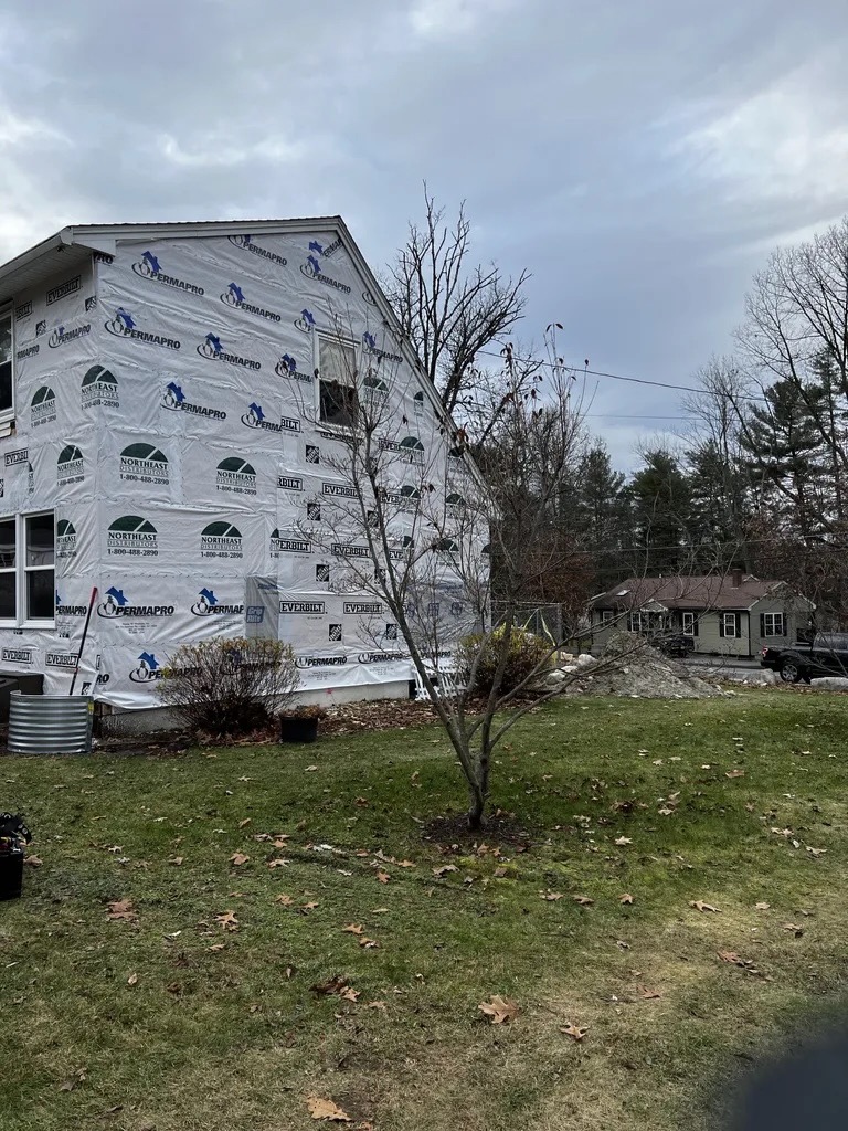 Exterior — housewrap and sheathing stage