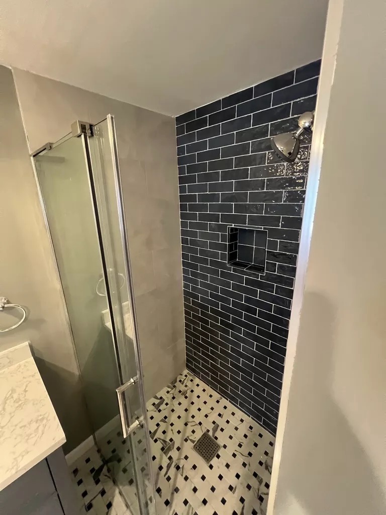 Black subway tile shower — interior view