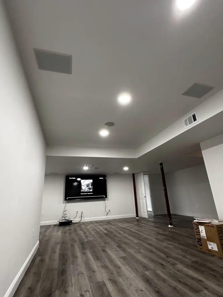 Finished rec room — in-ceiling speakers and coffered ceiling