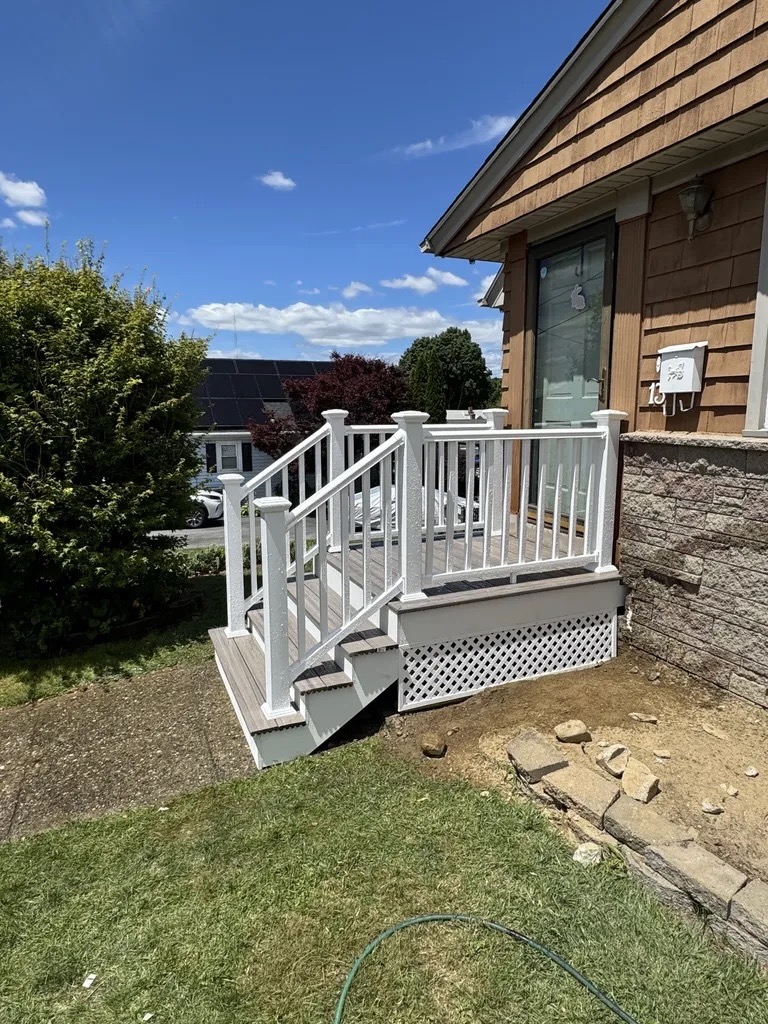 Composite deck with white vinyl railing — front view