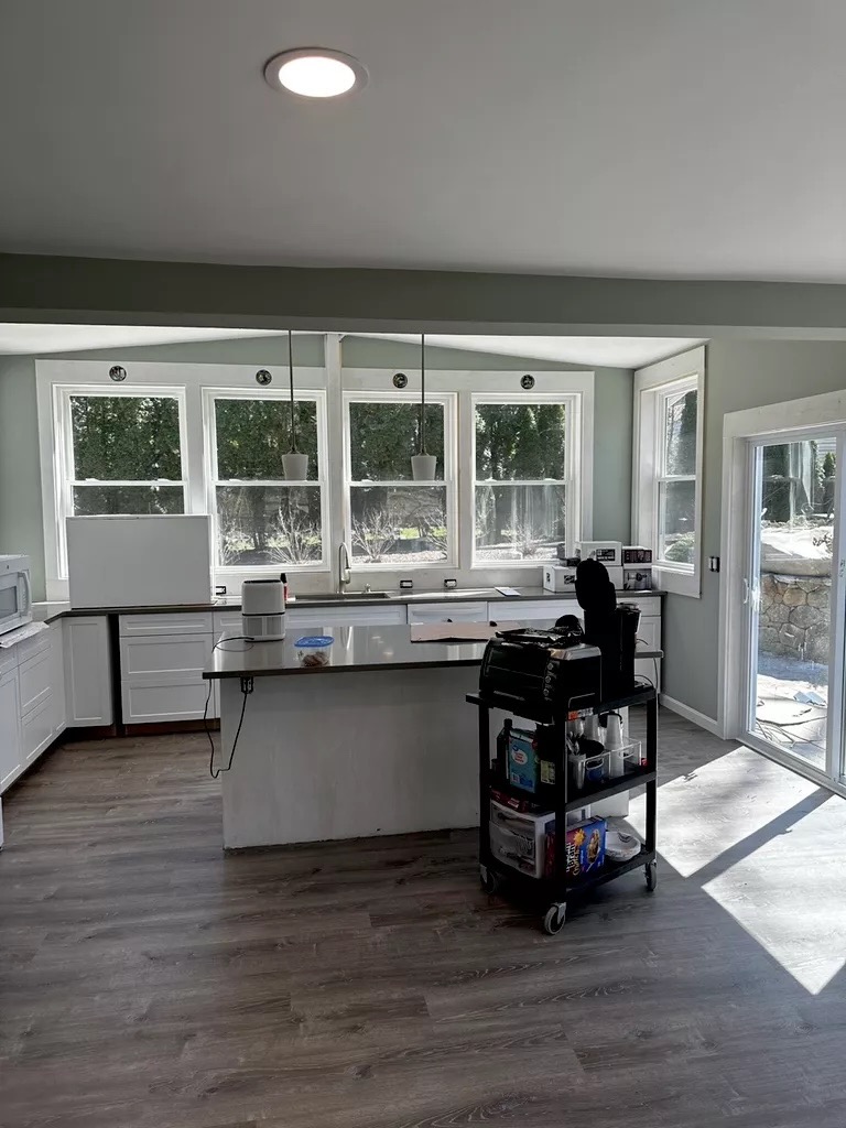 Completed kitchen — island with pendant lighting